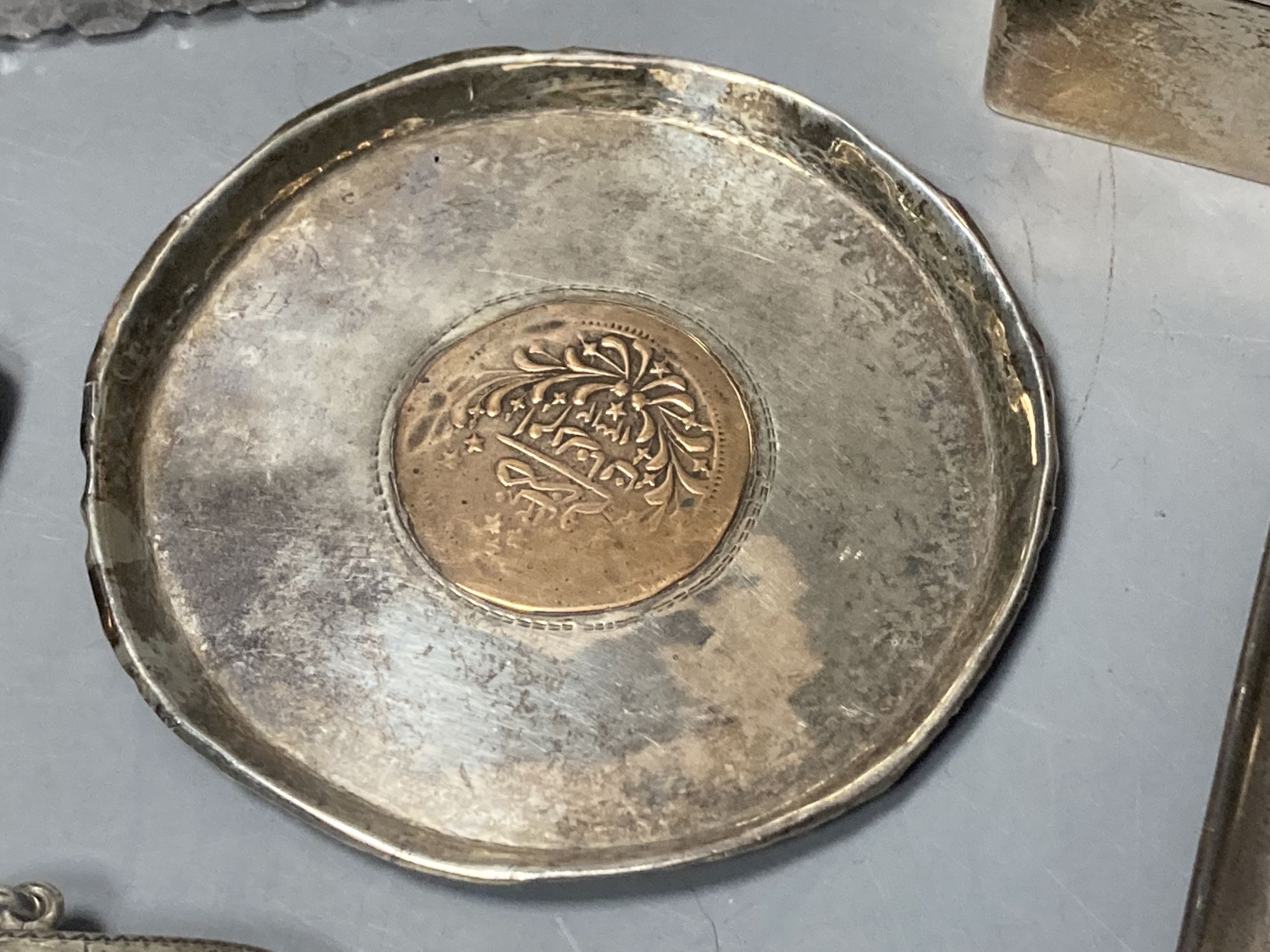 A silver cigarette box, silver cigarette case, four vestas including two silver, a continental dish and a toilet jar.